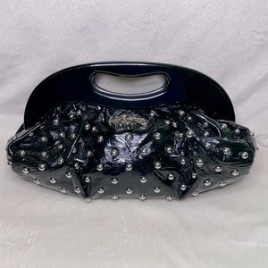 Betsey Johnson purse with silver metal details and faux patent leather